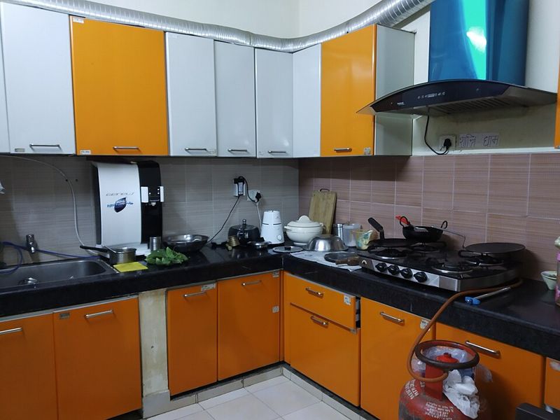 A home kitchen with steel vessels on the counter